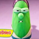 Green VeggieTales character with a sad, droopy expression on a pink background, VeggieTales logo in the corner.