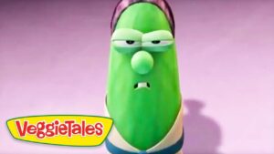 Green VeggieTales character with a sad, droopy expression on a pink background, VeggieTales logo in the corner.