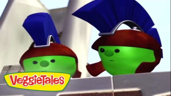 Two green VeggieTales characters with blue helmets peek over a brick wall, VeggieTales logo in the corner.