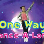 YouTube-style thumbnail: a girl jumping with one arm raised, colorful swirl background, and the title 'One Way Dance-A-Long' in bold letters.