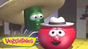 Red tomato character wearing a white hat smiles next to a green veggie wearing a large straw hat; VeggieTales logo in corner.