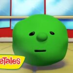 Green round VeggieTales character with a small nose and straight mouth in a dance studio; VeggieTales logo in the lower-left corner.