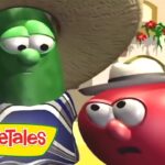 Larry the Cucumber wearing a sombrero and striped poncho stands beside a red tomato character wearing a hat, in a bright VeggieTales scene with the logo.
