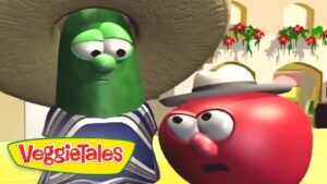 Larry the Cucumber wearing a sombrero and striped poncho stands beside a red tomato character wearing a hat, in a bright VeggieTales scene with the logo.