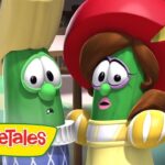 Two VeggieTales characters, a green cucumber and a green bean, wearing clothes, look surprised in a close-up scene.