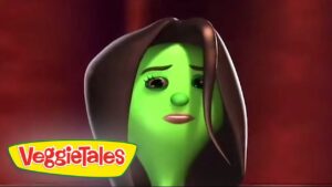 Sad green VeggieTales character in a brown hood against a red background, VeggieTales logo bottom left.
