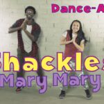 Thumbnail of two people dancing in a studio with bold text: 'Dance-A-Long' at the top, 'Shackles' in large yellow letters, and 'Mary Mary' below.