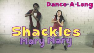 Thumbnail of two people dancing in a studio with bold text: 'Dance-A-Long' at the top, 'Shackles' in large yellow letters, and 'Mary Mary' below.