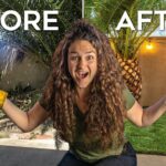 Excited woman with curly hair and a yellow glove on one hand stands in a sunny backyard with 'BEFORE' and 'AFTER' text above.