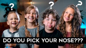 Four smiling kids lined up with question marks above their heads, a bold caption reading 'DO YOU PICK YOUR NOSE???'