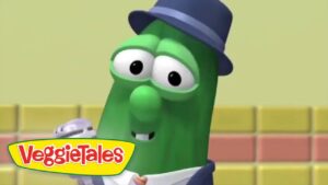 Larry the Cucumber from VeggieTales wearing a blue hat, smiling against a colorful background with the VeggieTales logo in the corner