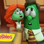 Green cucumber character in a shirt and striped tie stands close to a red-haired female veggie in a kitchen, with the VeggieTales logo in the lower-left corner.