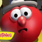 Red spherical VeggieTales character wearing a gray hat with a surprised expression; VeggieTales logo in the lower-left corner.