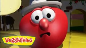 Red spherical VeggieTales character wearing a gray hat with a surprised expression; VeggieTales logo in the lower-left corner.