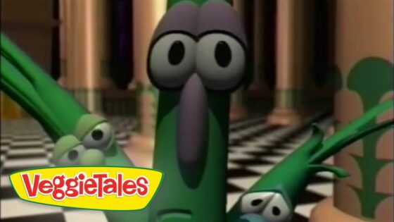 Larry the cucumber with wide eyes and raised arms in a checkerboard hallway; VeggieTales logo in the corner.
