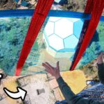 YouTube thumbnail showing a man in sunglasses on a glass walkway high above ground, with a large red axe between the glass panels and bold 'GIANT AXE' text in the corner.