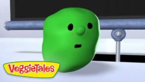 Green VeggieTales character with a surprised expression, in a white setting, VeggieTales logo in the corner