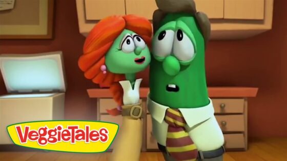 Two VeggieTales characters, a green cucumber man and a red-haired woman, share a moment in a kitchen with a VeggieTales logo in the corner.