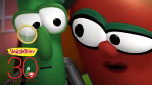 VeggieTales 30th Anniversary logo with two cartoon vegetables peeking at the camera via a magnifying glass.