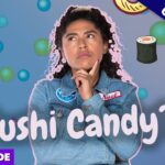 Thoughtful woman in a denim jacket surrounded by candy bubbles, sushi icon, and Japan flag; YouTube thumbnail for 'Sushi Candy?!' exclusive full episode.