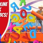 Thumbnail showing a cowboy in a hat on a trampoline obstacle course with giant colorful foam letters floating around and a Texas state badge on the right.