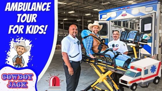 Paramedics pose with a patient on a stretcher beside an ambulance during a kids' ambulance tour event, with a blue panel reading 'Ambulance Tour for Kids' and cartoon cowboy.