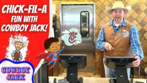 Chick-fil-A promo thumbnail: a smiling cowboy employee at a register, with a red panel reading 'CHICK-FIL-A FUN WITH COWBOY JACK!'