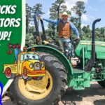 Man in a cowboy hat standing on a green John Deere tractor beside a cartoon tow-truck graphic and bold left-side text.