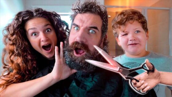 A bearded man with surprised expressions, flanked by a woman and a child, as a pair of scissors hovers near his beard in a playful scene.