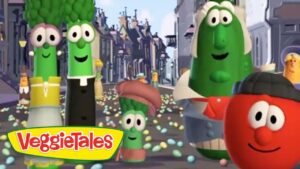 Scene from VeggieTales: animated vegetables marching in a parade on a city street, smiling faces, colorful confetti, logo visible.