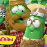 Group of VeggieTales characters in medieval armor pose together with the VeggieTales logo in the lower-left corner, outdoors in a green, forested setting.