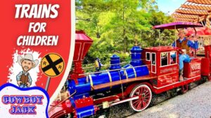 Colorful toy train with a waving cowboy in the cab, beside a 'Trains for Children' banner and 'Cowboy Jack' logo.