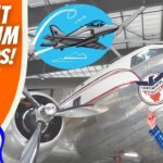 Thumbnail for a kids’ flight museum video: an orange panel reading “Flight Museum for Kids!” with a cartoon cowboy, beside a real man in a cowboy hat pointing at a vintage silver propeller airplane showing the Continental Air Lines logo.