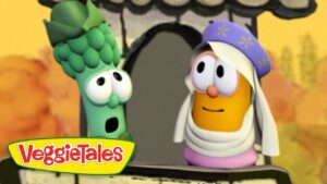 Two VeggieTales characters at a doorway: a green broccoli with wide eyes and a surprised look beside an orange veggie wearing a white headscarf and purple hat, with the VeggieTales logo in the corner.