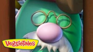 Close-up of a green cartoon character with a pink nose, round glasses, and a white beard; VeggieTales branding in the corner.