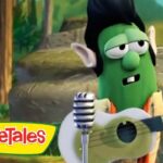 Green VeggieTales character with guitar performing outdoors, VeggieTales logo visible in the corner.
