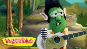 Green VeggieTales character with guitar performing outdoors, VeggieTales logo visible in the corner.