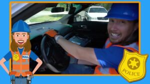 Driver wearing blue hard hat and orange safety vest, smiling, seated at the steering wheel inside a car; cartoon police frame and badge surround the image