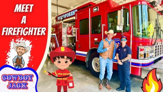 Event at a fire station: a red fire truck with two people posing beside a cartoon cowboy and firefighter stickers in the foreground.