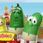 Group of VeggieTales vegetables smiling in a colorful animated scene with a cartoon castle in the background and the VeggieTales logo bottom left.
