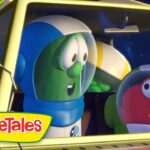 Green cucumber character in a blue space helmet sits in a yellow spaceship cockpit with a red, cheerful tomato character beside him.