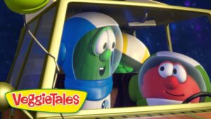 Green cucumber character in a blue space helmet sits in a yellow spaceship cockpit with a red, cheerful tomato character beside him.