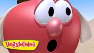 Close-up of a red VeggieTales character with wide eyes and open mouth, desert background, VeggieTales logo in the corner.