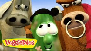 Close-up of three animated VeggieTales characters smiling, with a green vegetable in the center and the logo in the bottom-left corner.