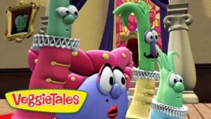 Colorful VeggieTales characters in white ruffled collars gathered in a church-like room with a stained-glass window in the background.