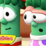 Two green cartoon vegetables from VeggieTales with surprised expressions, standing indoors; VeggieTales logo visible in the bottom left corner.