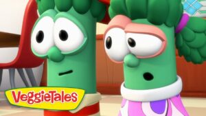 Two green cartoon vegetables from VeggieTales with surprised expressions, standing indoors; VeggieTales logo visible in the bottom left corner.