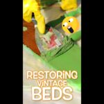 Gloved hand painting a bed frame green with a paintbrush; bold orange text reads 'Restoring Vintage Beds' over the scene