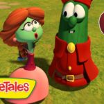 Two VeggieTales characters stand on a grassy field, one with orange hair and a pink dress and the other in a red outfit, both looking surprised. VeggieTales logo appears bottom left and a 30 Min badge is on the top right.