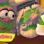 Two VeggieTales characters—green vegetables with glasses sharing a moment, logo visible in the corner.